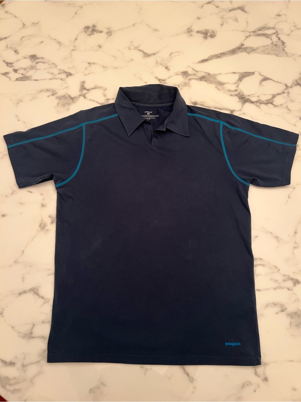 Patagonia Men's Navy Polo Shirt with Teal Stitching, Size Medium